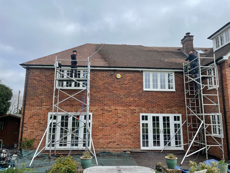 Roof cleaning carried out safely from scaffold towers by The Roof Moss Cleaners in Winchcombe